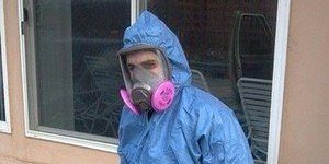 Water Damage Restoration Technician In Full Gear