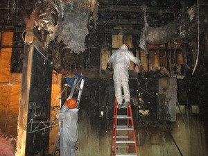 Technicians Repairing A Home From Wind Damage